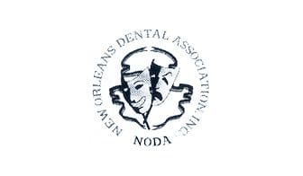 A black and white logo of the new orleans dental association.