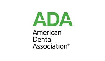 A green and white logo for the american dental association.